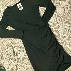 Holiday green bodycon dress with flattering side ruching.